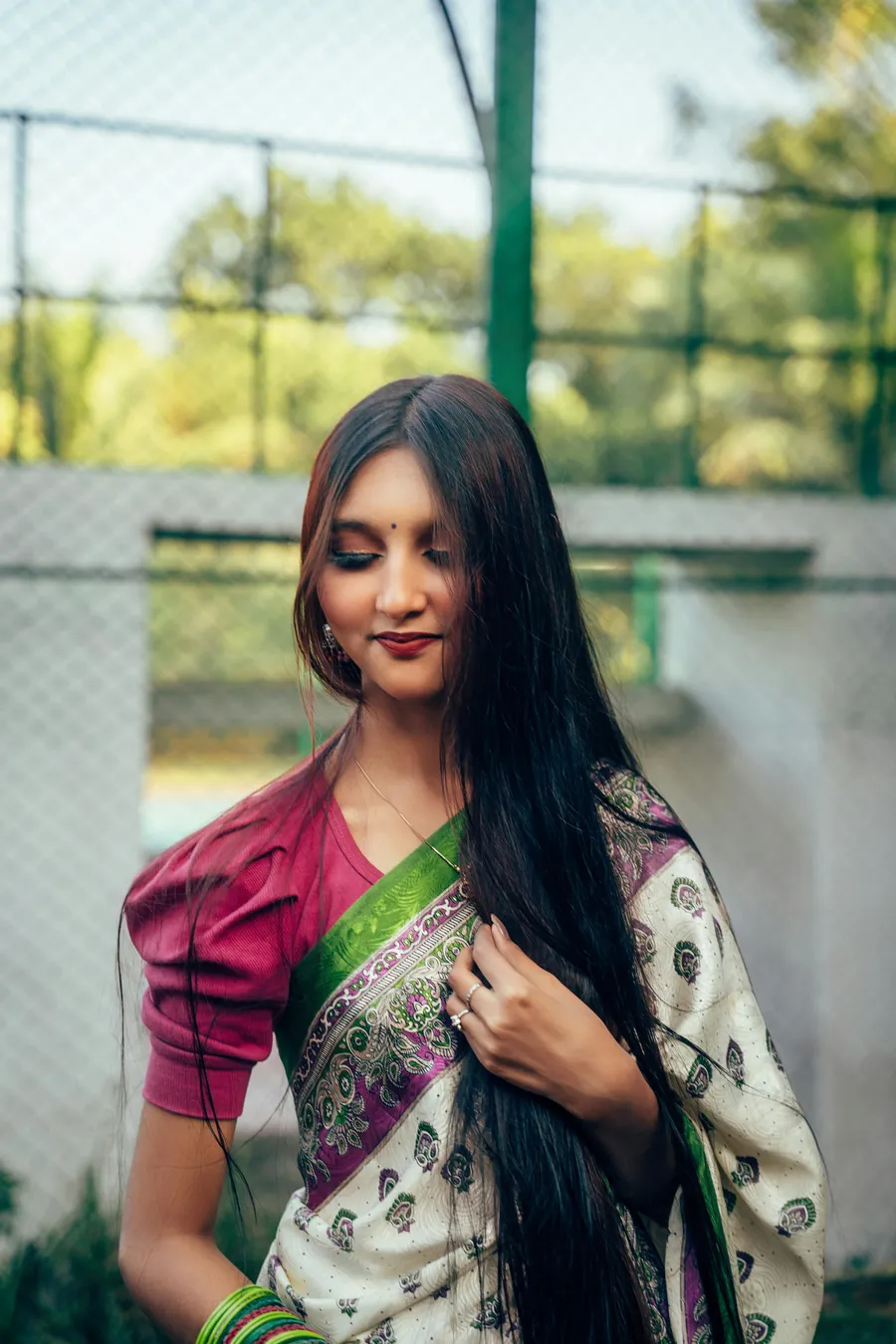 A woman wearing a brightly coloured saree