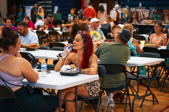 Guests seated together sharing plates of food