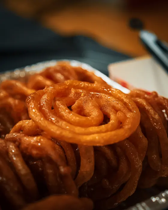 A close-up of freshly made jalebi